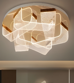 Modern ceiling light fixture with geometric design on a neutral background