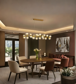 Modern dining room with round table, chairs, and a chandelier.