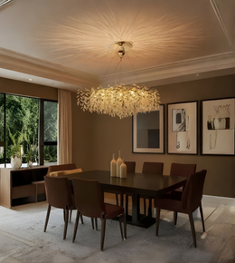 Dining room with a chandelier, table, and chairs in a well-lit room.