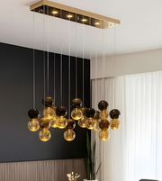 Modern chandelier with glass bulbs hanging from the ceiling.