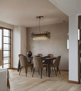 Dining room with a modern chandelier, table, and chairs.
