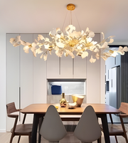 Modern chandelier hanging above a dining table in a stylish kitchen.