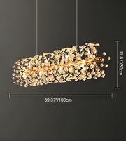 Gold chandelier with dimensions on a dark background