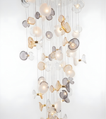 Decorative chandelier with glass and metal elements on a white background