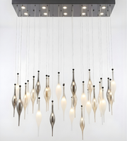 Modern chandelier with hanging lampshades on a white background