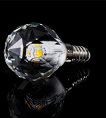 Crystal-like LED light bulb on a black background