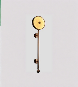 Decorative wall light fixture with a gold finish on a light gray background