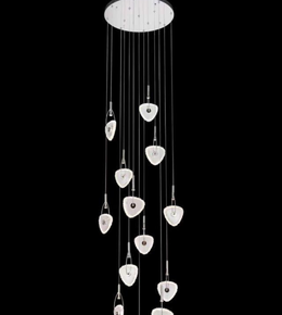 Modern chandelier with hanging crystal-like elements on a black background