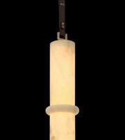 Pendant light fixture with cylindrical design on a black background