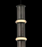 Decorative black and gold cylindrical object on a white background