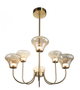 Chandelier with gold finish and glass shades on a white background