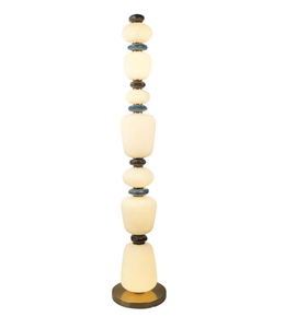 Decorative floor lamp with stacked stone-like design on a white background