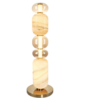 Decorative lamp with marble-like design on a white background