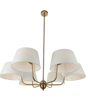 Chandelier with white lampshades and gold fixture on a white background