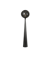 Decorative black spherical object on a long thin stand against a white background