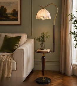 Living room with a floor lamp, sofa, and decorative elements.