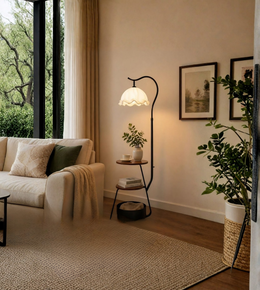 Cozy living room with a beige sofa, floor lamp, and decorative elements.