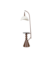 Decorative floor lamp with a white shade on a white background