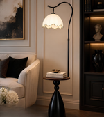 Floor lamp with a decorative shade in a living room setting.