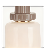 Beige perfume bottle with a brown cap on a white background