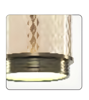 Metallic valve stem cap with engraved design on a white background