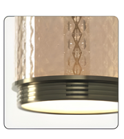 Decorative wall light fixture with textured glass shade on a white background