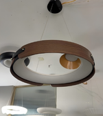 Ceiling light fixture with wooden frame and white glass cover