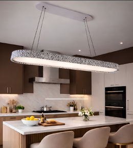 Modern kitchen with a long pendant light fixture.