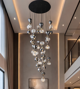 Modern chandelier hanging in a stylish interior setting with neutral tones.