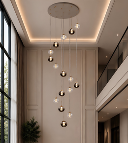 Modern chandelier hanging in a stylish interior setting with large windows and neutral walls.