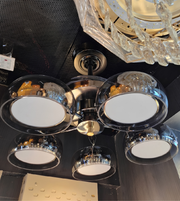 Modern chandelier with multiple light fixtures on a ceiling