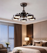 Modern bedroom with a ceiling light fixture, bed, and decor.