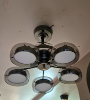 Chandelier with five light bulbs on a ceiling