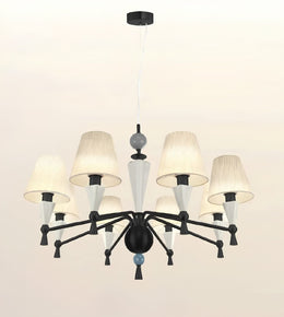 A modern 9-light chandelier with a black metal frame, textured off-white drum shades, and white glass cone accents, suspended from a ceiling.