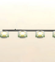 A modern linear ceiling light fixture with four cylindrical frosted glass shades and a matte black horizontal bar, shown against a plain off-white background.