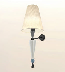 A modern wall sconce light fixture featuring a tapered beige pleated fabric shade, a matte black wall mount and arm, a white glass cone shade, and a small light blue decorative bead accent near the bottom.