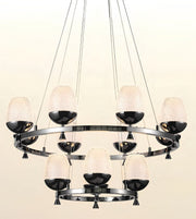 A modern multi-light chandelier with a circular chrome ring, nine textured frosted glass shades, and glossy black bowl-shaped metal accents, suspended by thin cables against a light beige background.