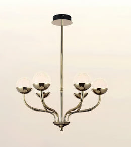 A modern 5-light chandelier with a polished brass-finished metal frame, curved arms, and textured white glass globes, suspended from a black ceiling canopy against a light beige background.