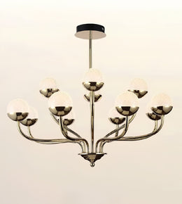 A modern 9-light chandelier with a polished silver-tone metal frame and textured white glass globes, suspended from a black ceiling canopy against a light beige background.