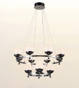 A modern multi-light chandelier with a polished silver-tone metal frame, featuring multiple frosted glass shades and dark metal cup holders, suspended from a circular ceiling canopy against a plain light background.