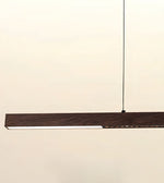 A modern linear LED pendant light with a dark wood-grain finish and a slim black suspension cord, shown against a plain off-white background.