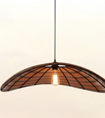 A modern pendant light with a curved, fan-like shade made of dark metal bars and warm brown wood slats, suspended by a black cord with a glowing Edison bulb in the center, set against a plain off-white background.