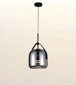 A modern pendant light with a glossy, reflective metallic dome shade suspended by a slim black cord from a round black ceiling canopy, set against a plain light beige background.