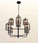Luxury six-light smoked glass chandelier with matte black frame and smoked glass dome shades in white background.