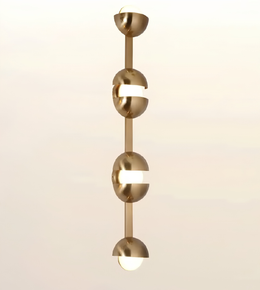 A modern vertical pendant light fixture with four elongated metallic gold spherical shades separated by horizontal white bars, shown against a soft beige gradient background.
