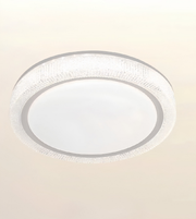 A modern circular flush-mount ceiling light fixture with a textured clear glass outer ring and a frosted white center, shown against a plain off-white background.