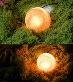 A dual-panel photo showing a glowing spherical lamp placed among green moss. The top panel shows the lamp lit with a warm orange glow, and the bottom panel shows the same lamp glowing with a warm yellow/orange light in a darker mossy setting.