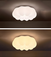 Two views of a cloud-shaped ceiling light fixture on a dark background.
