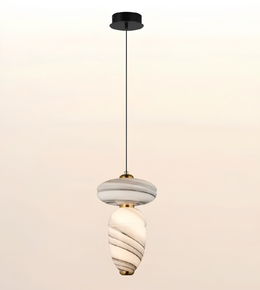 Modern marble-effect glass pendant light with sculptural double-form design, brushed brass accents, and warm ambient illumination.