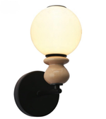 Wall-mounted light fixture with a round glass shade and wooden base on a white background